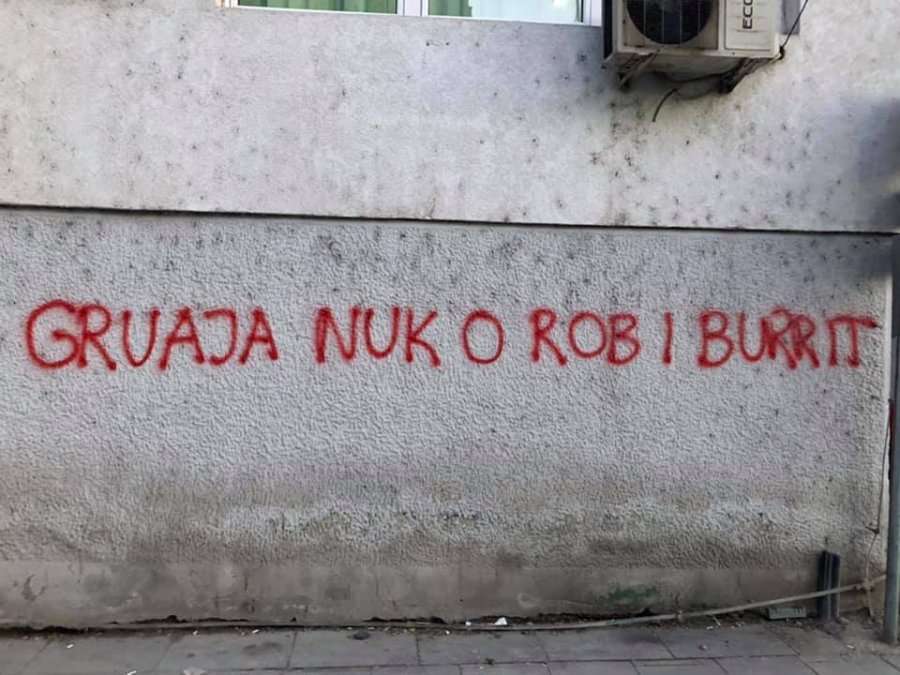 Graffiti is written against systematic violence against women in Mitrovica
