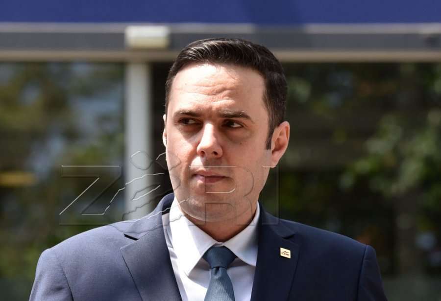 Abdixhiku consoles Krasniqi after the murder of two PDK officials in Peja