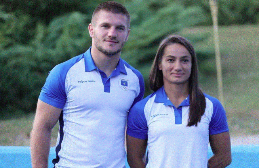 Majlinda Kelmendi and Akil Gjakova, carry the flag at the opening ceremony of the Tokyo 2020 Olympic Games